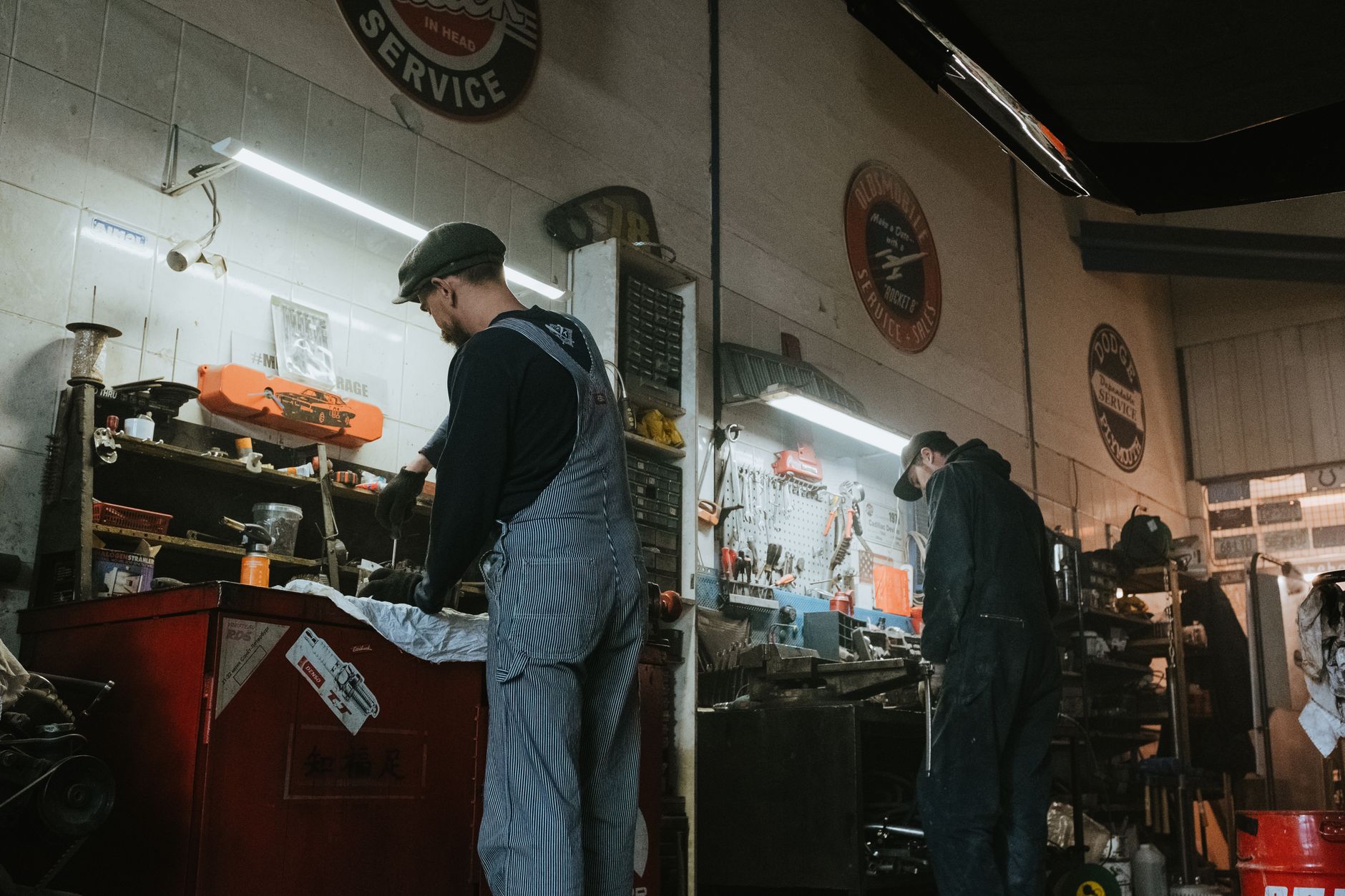 Two mechanics working in a workshop; representative photography, not the Advance Automotive shop or team